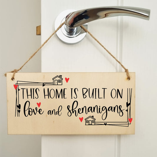 The Plum Penguin Handmade Wooden Hanging Wall Plaque Home Built on Love and Shenanigans Fun Sentimental Decorative Sign Family