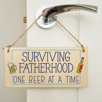 The Plum Penguin Handmade Wooden Hanging Wall Plaque Surviving Fatherhood One Beer at a Time Novelty Sign Man Cave